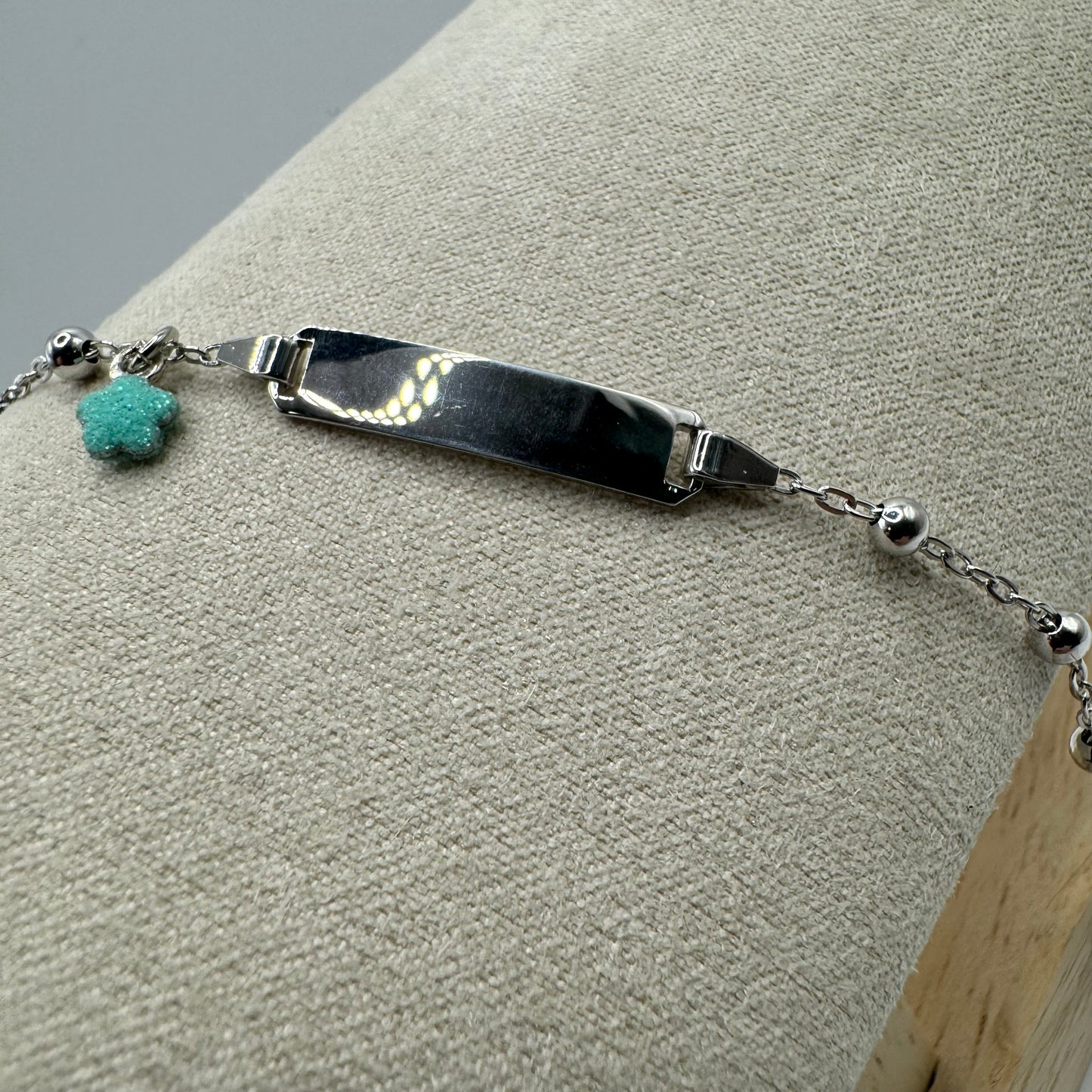 BR TARGHETTA CON FIORE GLITTER