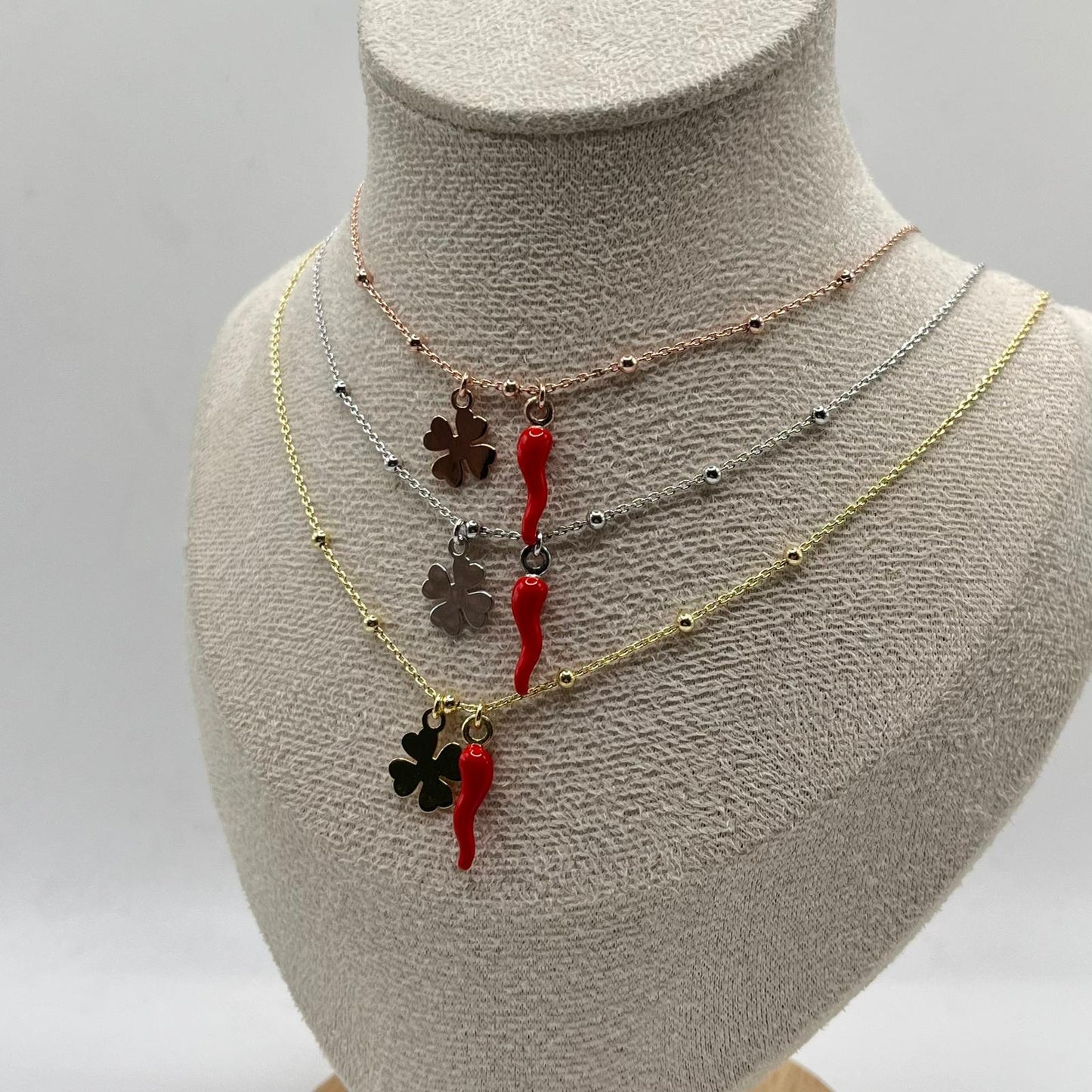 CL PALLINE CORNO E CHARM QUADRIFOGLIO