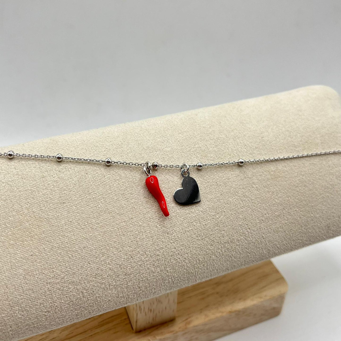 BR PALLINE CORNO E CHARM CUORE