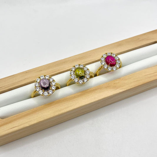 AN PIETRA CENTRALE COLORATA E ZIRCONI