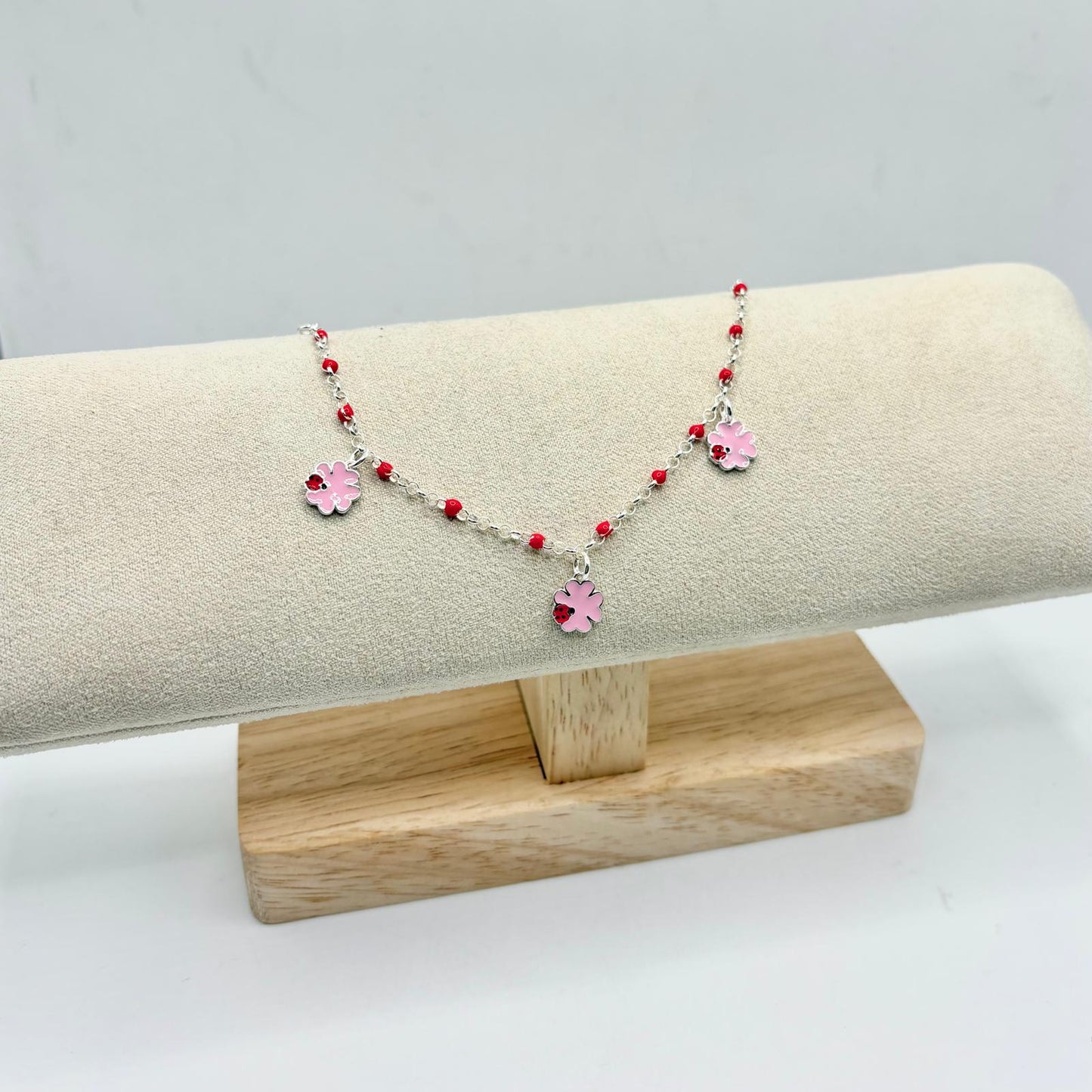 BR PERLINE ROSSE E QUADRIFOGLI CON COCCINELLA PENDENTI